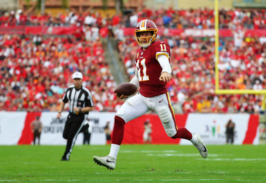 Washington Redskins quarterback Alex Smith (11) scrambles against the Tampa Bay Buccaneers at Raymond James Stadium on November 11, 2018, in Tampa, Florida. (Will Vragovic/Getty Images/TNS)