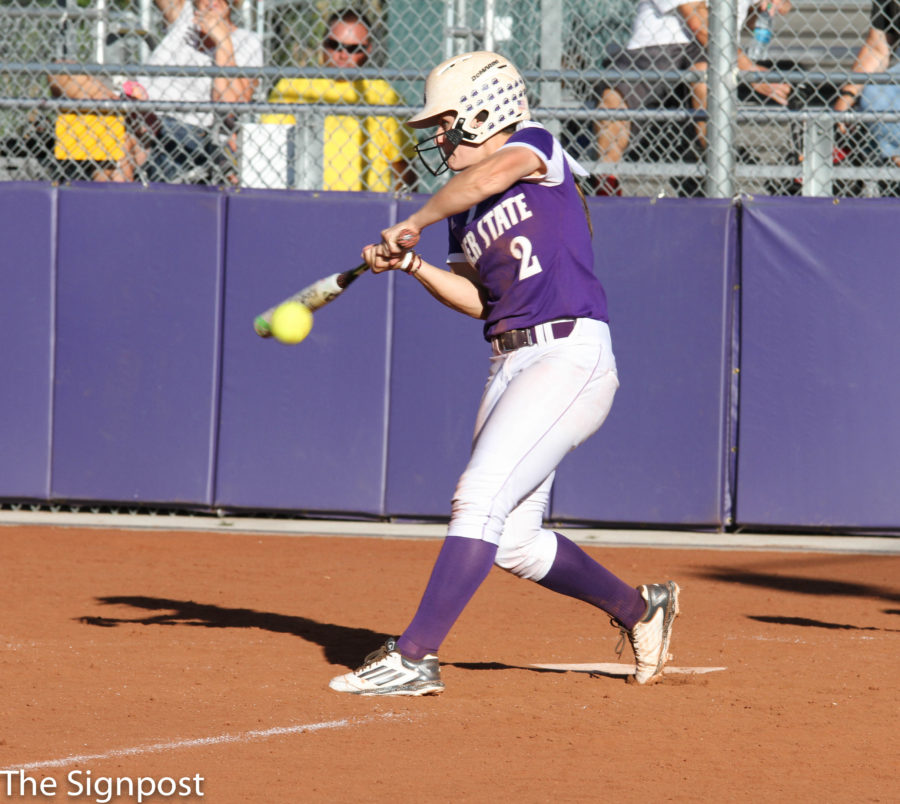 Sophomore McKinley Brinkerhoff hits the ball while playing against Southern Idaho.  (Ariana Berkemeier / The Signpost)