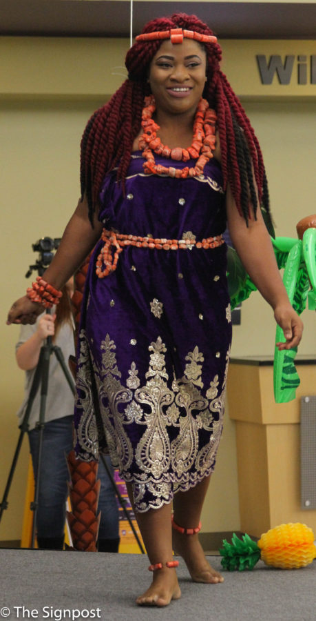 Harriet Ofeoriste Onyekapreye Egikimiaghan from Nigeria presents her native culture wear during the fashion show in The Union on Tuesday. (Cydnee Green / The Signpost)