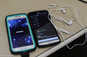 Pandora and Spotify being played on two phones.  (Ariana Berkemeier / The Signpost)