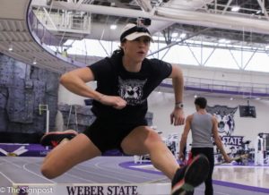 Tawnie Moore runs the hurdles with a GoPro. The video will be used for the Athlete Spotlight video on Tawnie. (Gabe Cerritos / The Signpost)