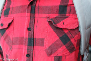 Nick Chase wearing his red flannel around campus. (Gabe Cerritos / The Signpost)