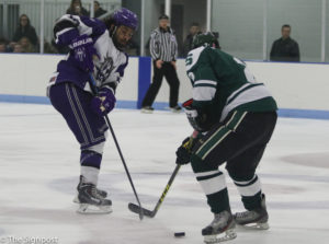 Left Wing Koda Coleman attempts to steal the puck from a Michigan State player. (Ariana Berkemeier / The Signpost)