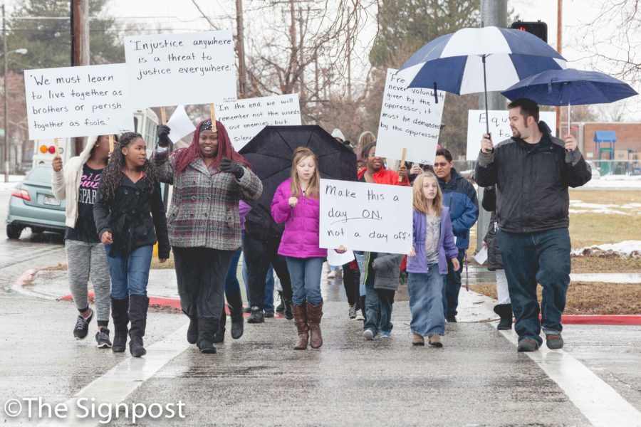 The annual Martin Luther King Jr. celebration concludes with a memorial march from the Marshall White Center to the Ogden Amphitheater. (Christina Huerta/The Signpost)
