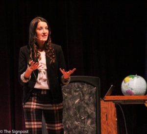 Author Hilary Corna shares her message about being a responsible global leader to students on Tuesday. (Abby Van Ess / The Signpost)