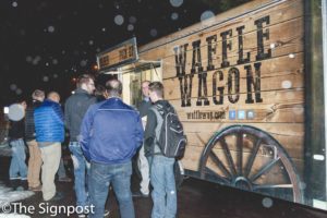 Students line up at the Waffle Wagon after hearing the owner Greg Timothy speak at the Subaru Entrepreneurship Lecture Series. (Christina Huerta/The Signpost)