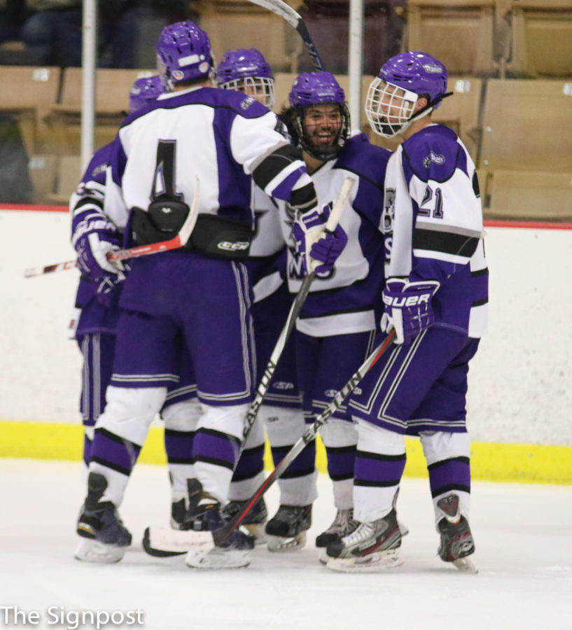 Wildcats celebrate a victory over BYU during the Wasatch Cup tournament.  (Ariana Berkemeier / The Signpost)