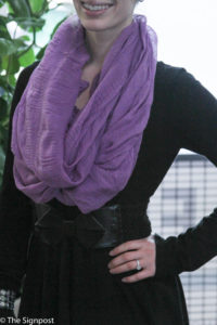 Amber Reeves accented her black dress with a purple infinity scarf. (Ariana Berkemeier / The Signpost)