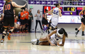 Regina Okoye was helped off the court late in the fourth quarter; she did return to finish the game. (Gabe Cerritos / The Signpost)