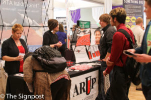 Students see what ARUP Laboratories has to offer for them at the WSU Career Fair on Tuesday. (Abby Van Ess / The Signpost)