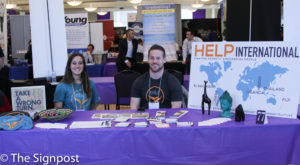 Jen Itri and Brenen Sidwell represent HELP International, a group that sends students abroad to to fight global poverty, at the WSU Career Fair on Tuesday. (Abby Van Ess / The Signpost)