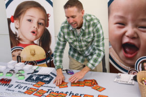 Brett Lund of the Davis Head Start sets up a game of go fish to win some candy. (Gabe Cerritos / The Signpost)