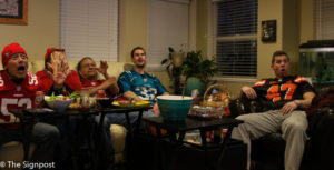 With flying chips, screaming fans and drinks flowing, Super Bowl parties are the ideal places to watch the big game. (Gabe Cerritos / The Signpost)