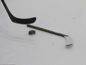 A broken stick stops play during the game against USU. (Ariana Berkemeier / The Signpost)