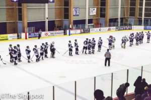 The WSU Men's Hockey team lines up to shake hands with USU after a 6-3 defeat. (The Signpost/Christina Huerta)