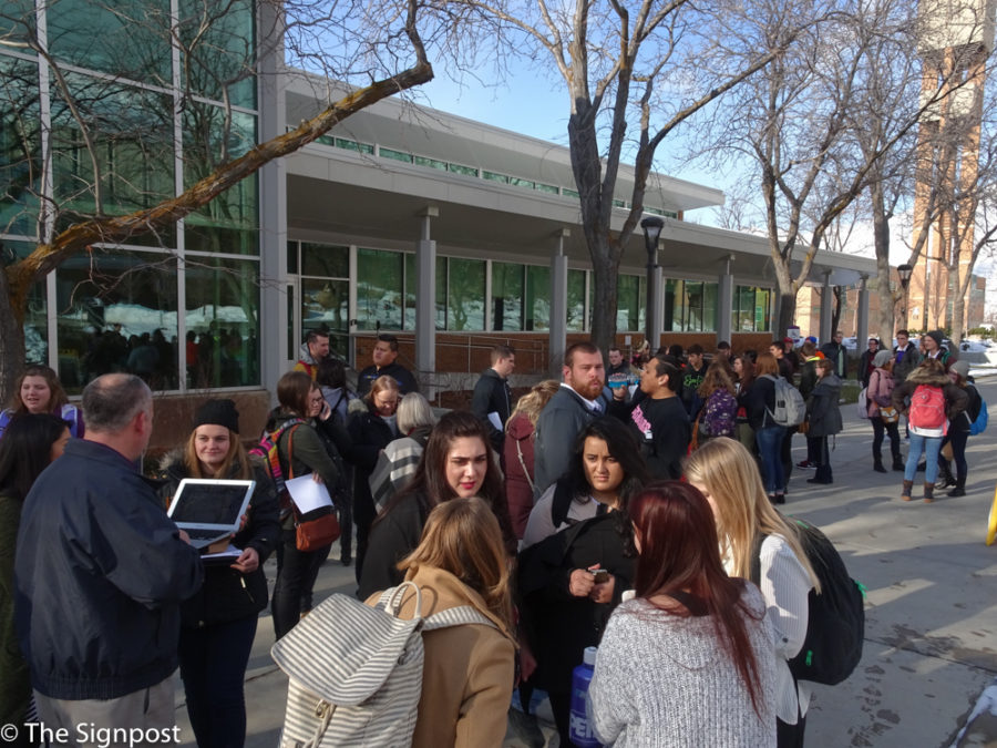 Students, staff, and faculty wait outside the Shepherd Union building after having been evacuated by a fire alarm on Jan. 25, 2016. (Emily Crooks / The Signpost)