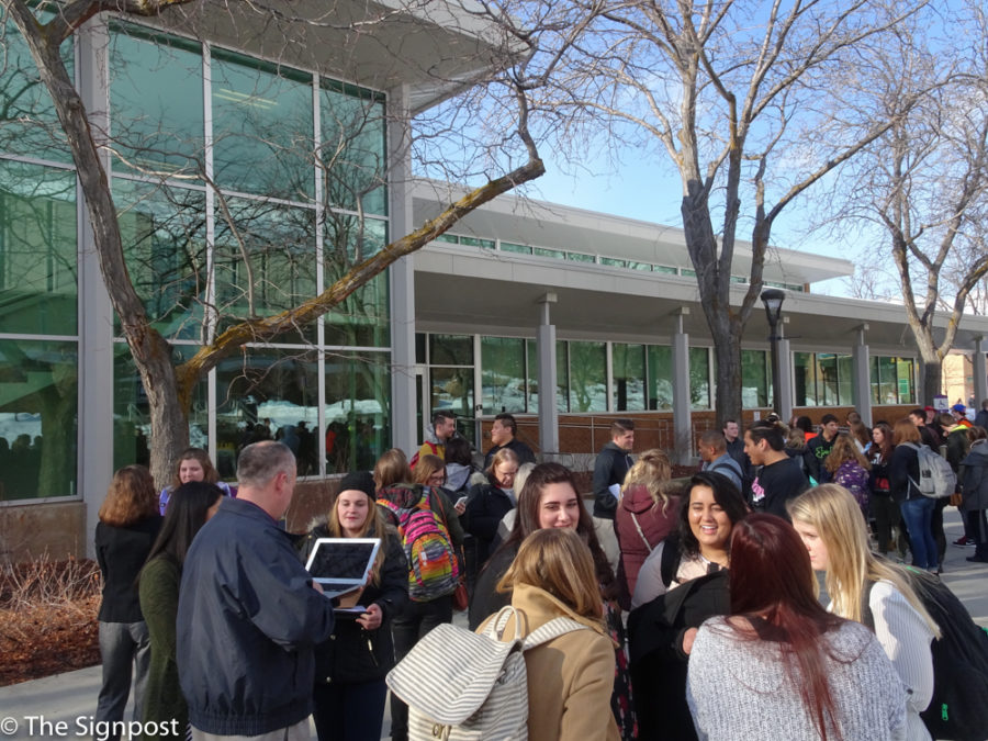 Students, staff, and faculty wait outside the Shepherd Union building after having been evacuated by a fire alarm on Jan. 25, 2016. (Emily Crooks / The Signpost)