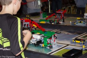 Elementary and junior-high children move through lego obstacles to battle their robots at the FIRST Lego League Qualifier Tournament in the Shepherd Union on Saturday, Jan. 9. The event was hosted by Weber State University's College of Engineering, Applied Science & Technology. (Daniel Rubio / The Signpost)