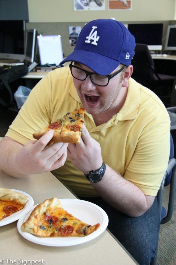 Charles Bowker eating pizza