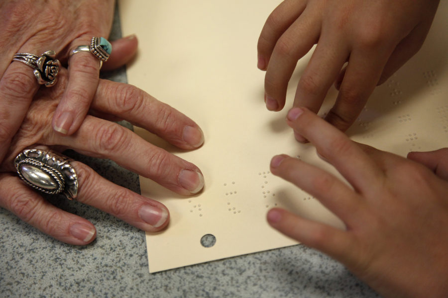 Zach Thibodeaux, 8, right, practices reading Braille with his tutor Beth Jeffrey during his after-school tutoring session at Mary Immaculate Catholic School in the city of Farmers Branch, Texas, March 3, 2011. Zach meets with his tutor several times a week to prepare himself with a life without sight. (Tom Fox/Dallas Morning News/MCT)