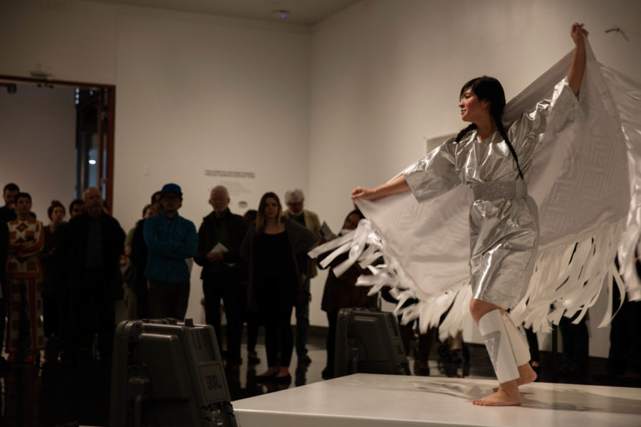 Elisha Harkins performs a Cherokee Disco Opera titled What You Pawn I Will Redeem at Mary Elizabeth Dee Shaw Gallerys opening night for We Are The People, an exhibition featuring works by indigenous artists. (Emily Crooks / The Signpost)