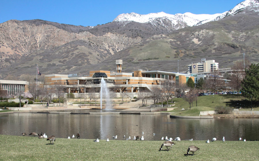 Campus looks beautiful from the pond with the fountain going off and the snow still topping the mountains. (Abby Van Ess / The Signpost)