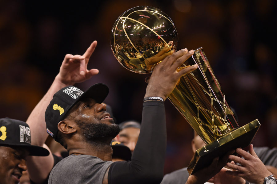 Cleveland Cavaliers LeBron James (23) holds up the Larry OBrien Trophy after defeating the Golden State Warriors in Game 7 of the NBA Finals on Sunday, June 19, 2016, at Oracle Arena in Oakland, Calif. (Jose Carlos Fajardo/Bay Area News Group/TNS)