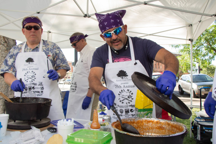 Luis Lopez of the Ogden City Council serves guests of the Real Men Can Cook competition at Ogdens City Hall Park on Tuesday, July 19. (Emily Crooks / The Signpost)