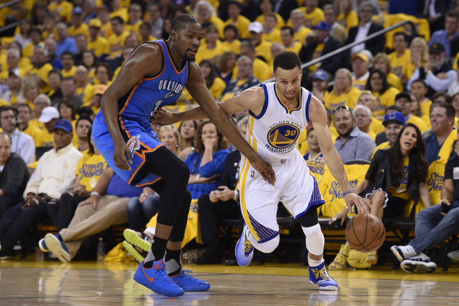 Golden State Warriors Stephen Curry (30) drives against Oklahoma City Thunders Kevin Durant (35) in the second quarter of Game 1 of the NBA Western Conference finals at Oracle Arena on May 16, 2016 in Oakland, Calif. (Nhat V. Meyer/Bay Area News Group/TNS)