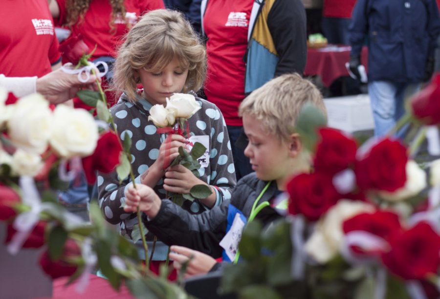 Children pick out roses to carry during the 9th Annual Suicide Awareness Walk in Ogden on Saturday, Sept 24. (Emily Crooks / The Signpost)