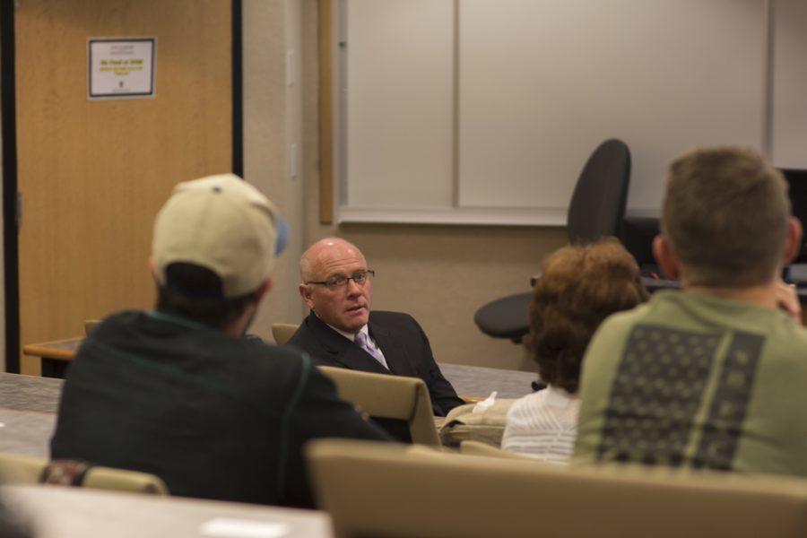 Chuck Kaiser, visiting Professor of Business Administration, joins Bennion in fielding questions from attendees. (Joshua Wineholt  / The Signpost)