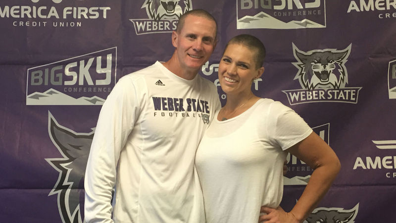 Weber State University football coach Jay Hill stands beside his wife, Sara Hill, who was recently diagnosed with stage 4 cancer. (Source: Weber State Athletics)