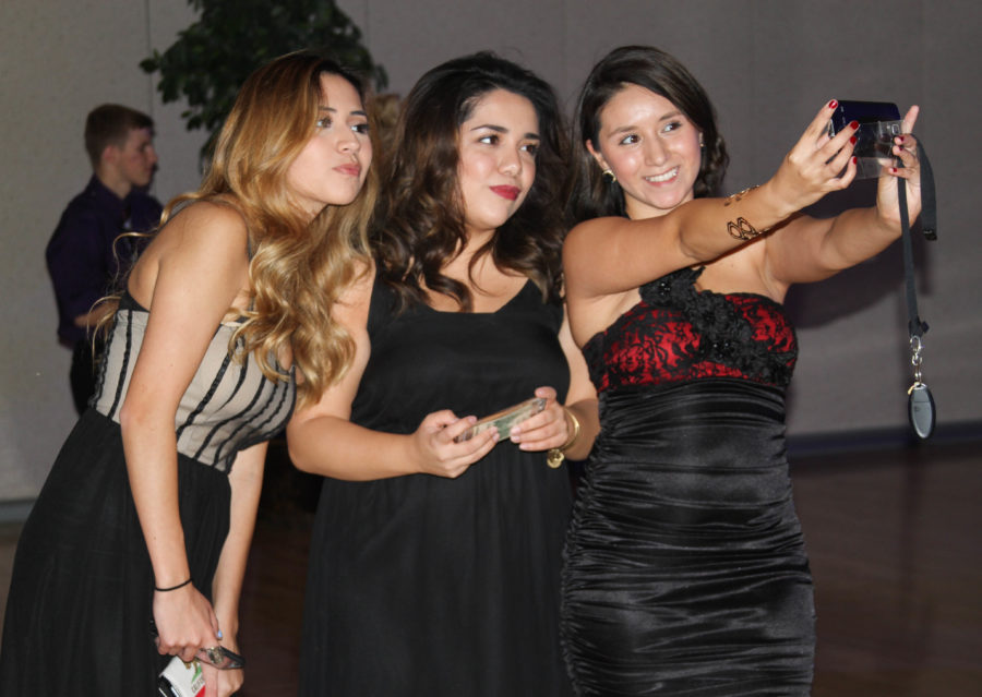Students take a selfie at the Homecoming dance last year. (The Signpost Archives)