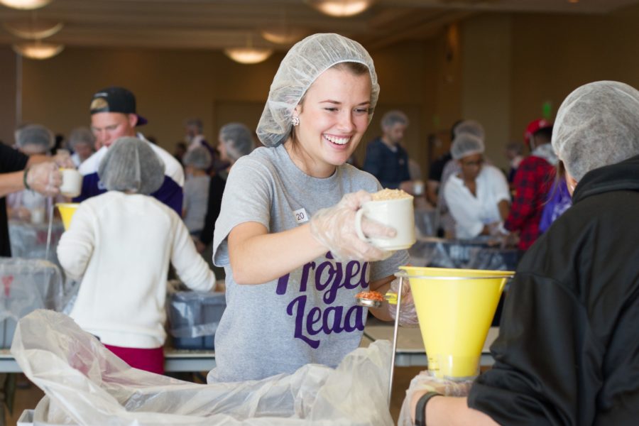 Weber State University students in Project Lead package food for third-world countries in the Shepherd Union on Oct. 21. Collectively, students produced 25,000 meals. (Emily Crooks / The Signpost)