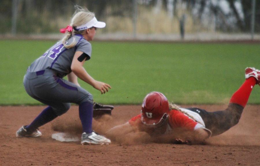 Utah slides into second as freshman Sydney White reaches to make the out Sept 29. (Abby Van Ess / The Signpost)