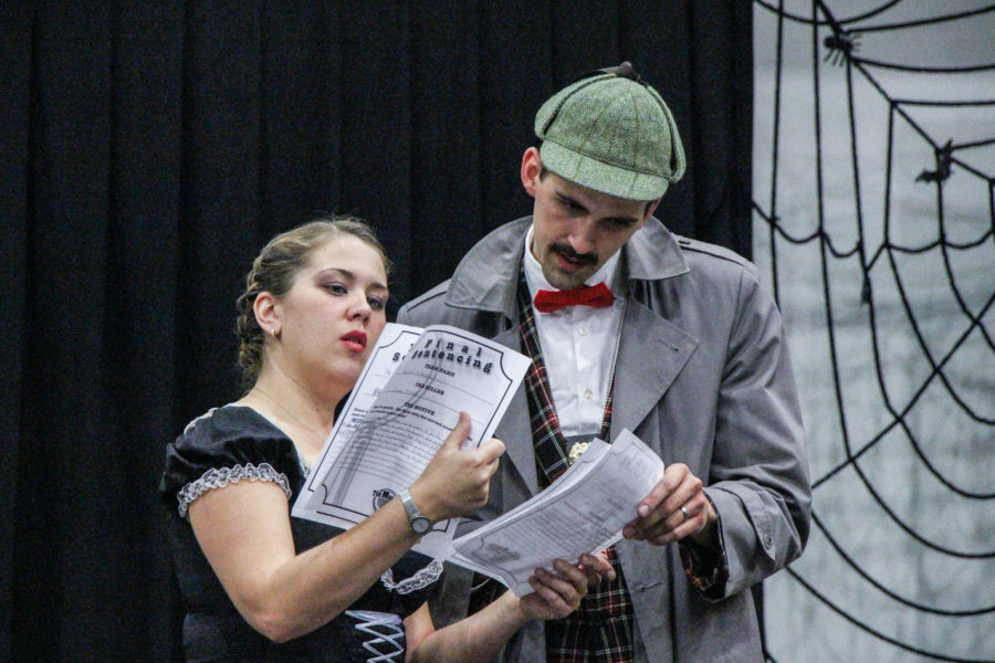 Murder Mystery Co. cast are in character as a housekeeper and detective during a mock murder mystery investigation at Davis campus in Oct. 2014. (The Signpost Archives)