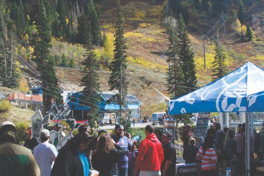 People line up in front of beer tent at Snowbirds Oktoberfest. (Erik Bremer / The Signpost)