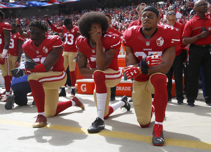 From left, San Francisco 49ers Eli Harold (58), quarterback Colin Kaepernick (7) and Eric Reid (35) kneel during the national anthem before their NFL game against the Dallas Cowboys on Sunday, Oct. 2, 2016 at Levis Stadium in Santa Clara, Calif. (Nhat V. Meyer/Bay Area News Group/TNS)