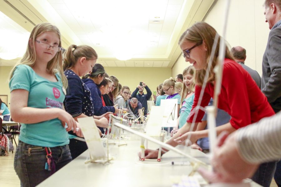 Parents and daughters test their drawbridges at Weber State Universitys Parent-Daughter Engineering Day in the Shepherd Union on Nov. 19. The annual event hopes to encourage women to pursue STEM fields. (Dalton Flandro / The Signpost)