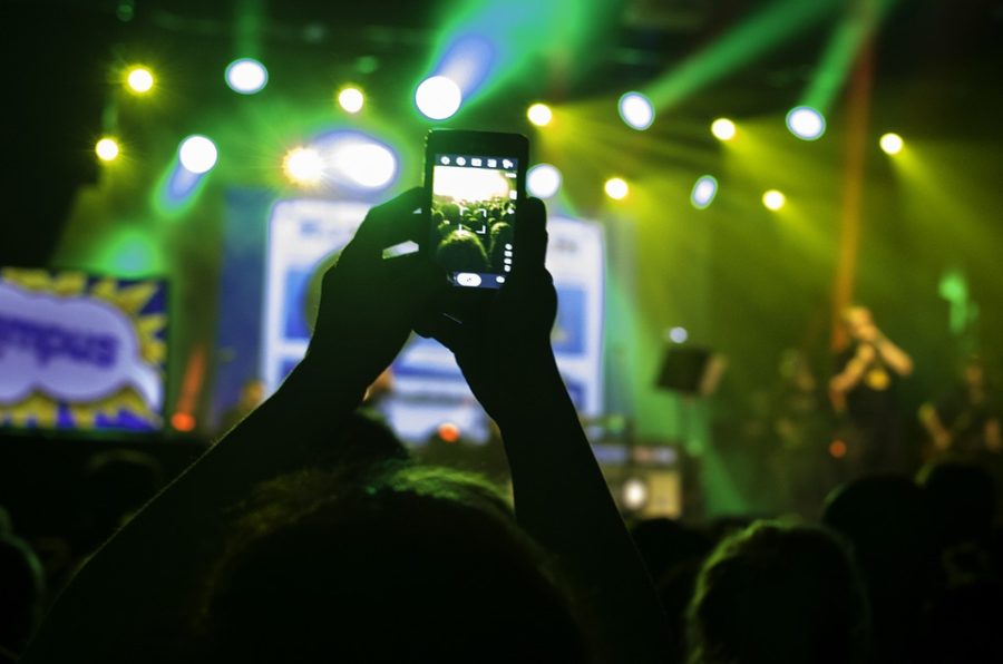 Concert goers attend shows and whip out their cell phones. People need to unplug and realize that theyre missing their lives,” says Corey Taylor, lead singer of Slipknot. (Source: pixabay.com)