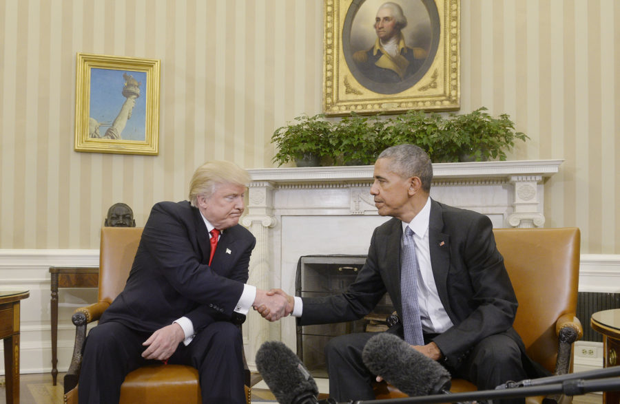 U.S. President Barack Obama shakes hands with President-elect Donald Trump on Thursday, Nov. 10, 2016 in the Oval Office of the White House in Washington, D.C. in their first public step toward a transition of power. (Source: Tribune News Service)