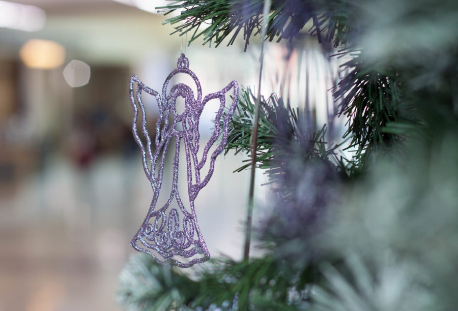 The Angel Tree in Weber State Universitys Shepherd Union atrium have tags with a childs information and interests for students and faculty to get holiday gifts for families in need. (Emily Crooks / The Signpost)