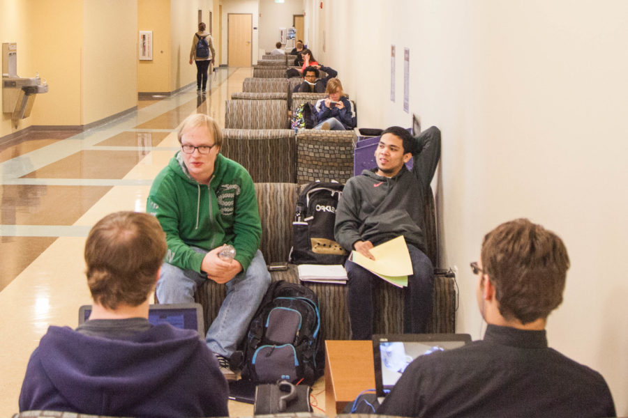 Students chat or study on the first floor of Elizabeth Hall in Spring 2016. When looking to improve academic performance, retaking classes may effect financial aid. (The Signpost Archives)