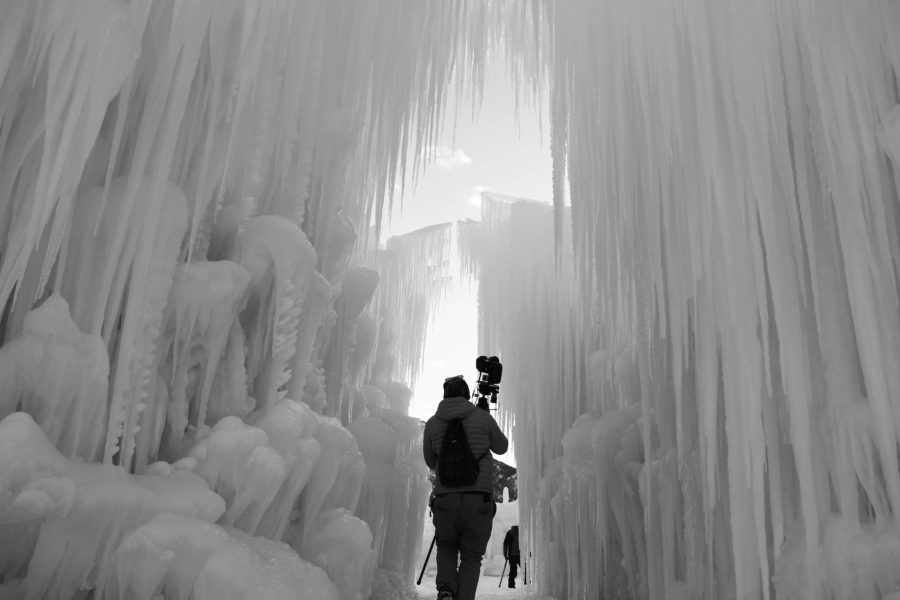 A photographer walks through the entrance of Midway Ice Castles. The castles are just one of many winter activities in Utah. (The Signpost Archives)