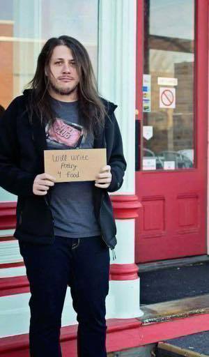 Featured PoetFlow poet and Weber State student Rees Sweeten holds a sign saying, will write poetry 4 food. (Source: Rees Sweeten)