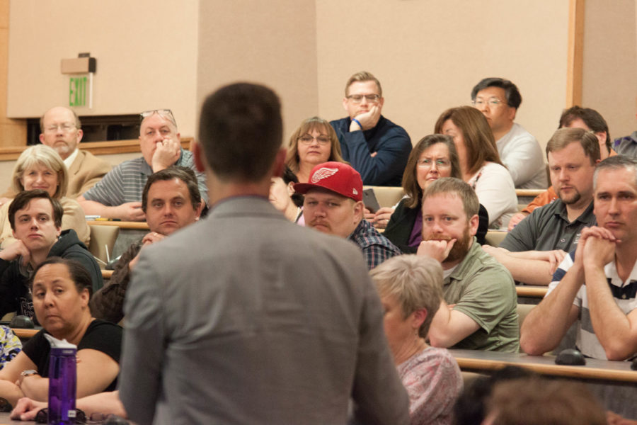 Brad Mortensen, Vice President for University Advancement at WSU, answers a question from faculty following President Chuck Wights discussion on the universitys funding during a packed lecture hall in Wattis Business Building on March 13. (Emily Crooks / The Signpost)