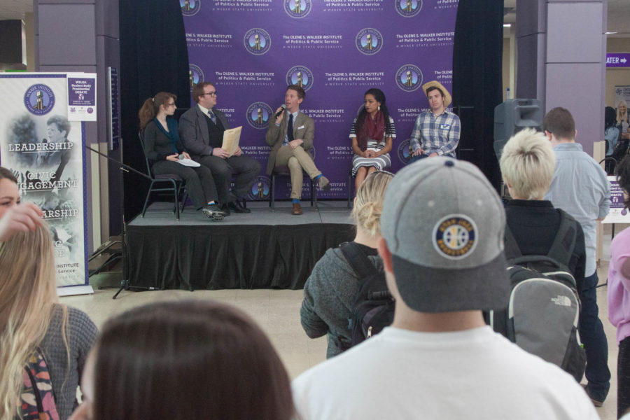 Moderators Hali McDonald and Charles Bowker, left, and 2017-18 WSUSA President candidates Colt Jarvis, Aulola Moli and David Gibbons participate in the WSUSA President debate in the Shepherd Union atrium on March 13 during executive election week. (Emily Crooks / The Signpost)