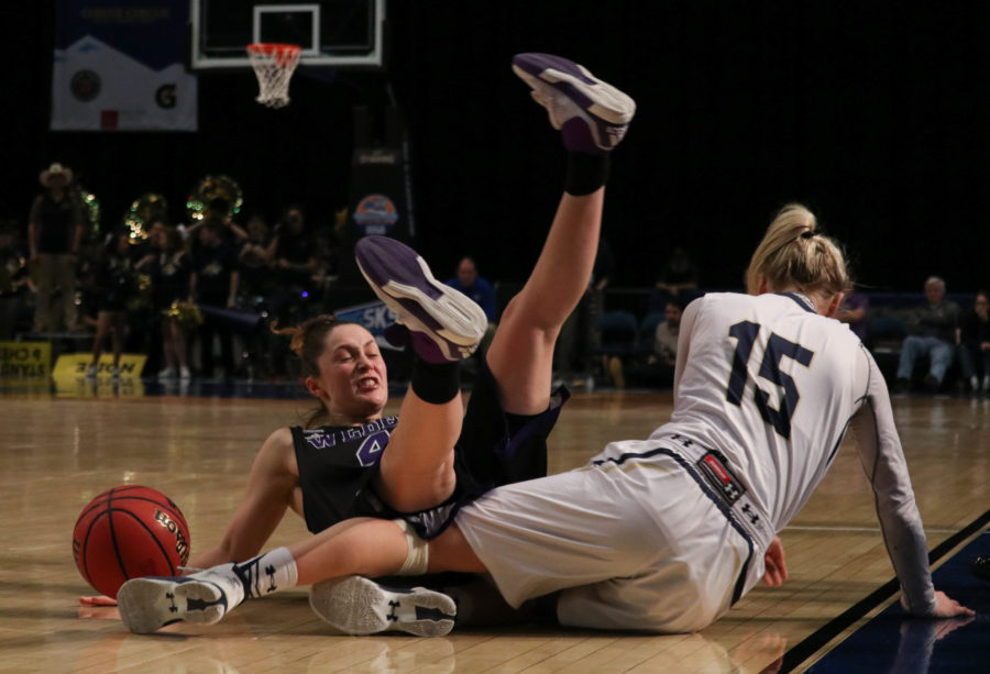 Guard Kailie Quinn falls to the floor after getting tripped by Montana State forward Riley Nordgaard during the quarterfinal game of the Big Sky Conference Championship Tournament. (Abby Van Ess / The Signpost)