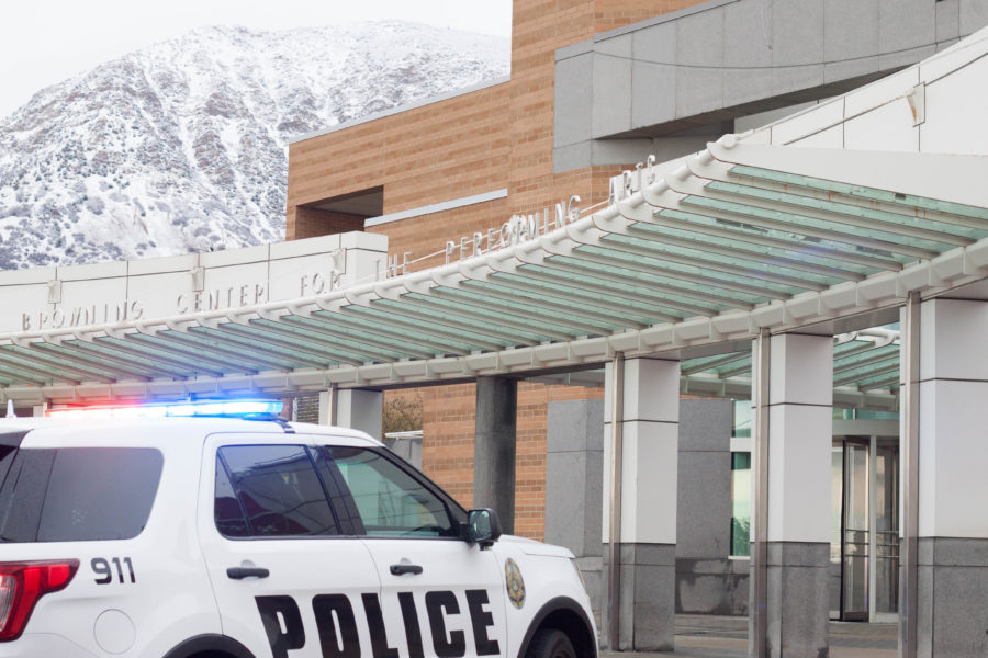 Weber State University police cars sit outside the Browning Center as officials work to maintain a flood in the building and evacuate students and faculty. (Emily Crooks / The Signpost)