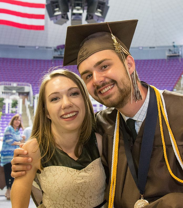 Senecca Corsetti poses with her brother Ashton Corsetti at his high school graduation in the Dee Events Center on June 2, 2016. (Source: Ashton Corsetti)